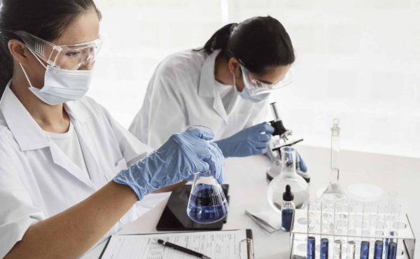 asian-women-working-together-on-chemical-project-scaled